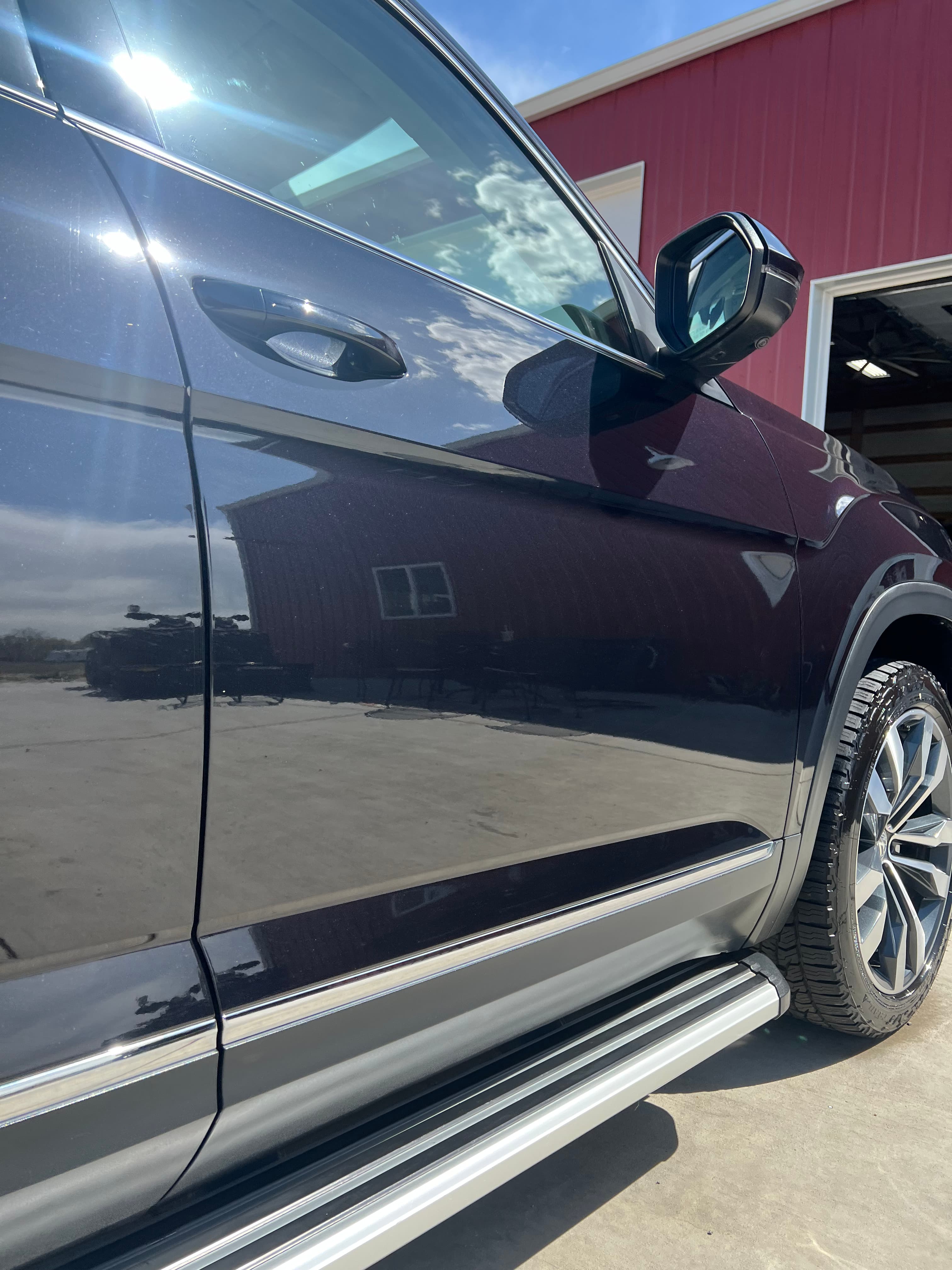 Before detailing - dirty SUV exterior with water spots and road grime in Loveland, Colorado